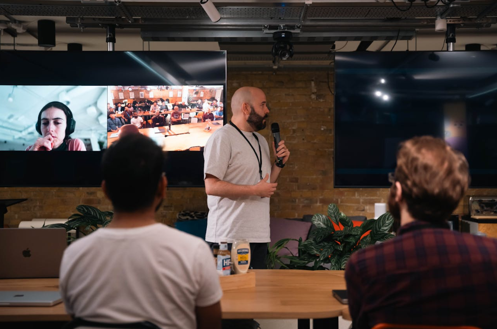 Corporate event planning hybrid format with in-person and virtual attendees