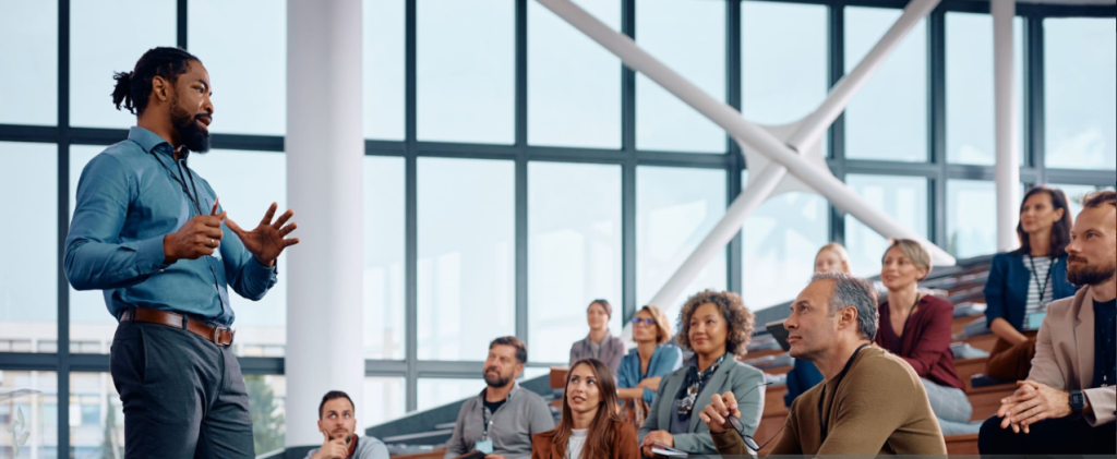 Professional facilitator leading corporate workshop Toronto demonstrating expertise required for interactive event formats beyond traditional presentation logistics